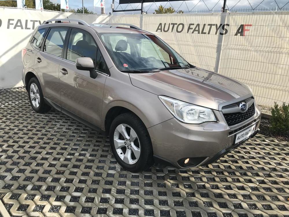 Metallic beige Subaru Forester 2013, front and side view of the car body, dealer Auto Faltys