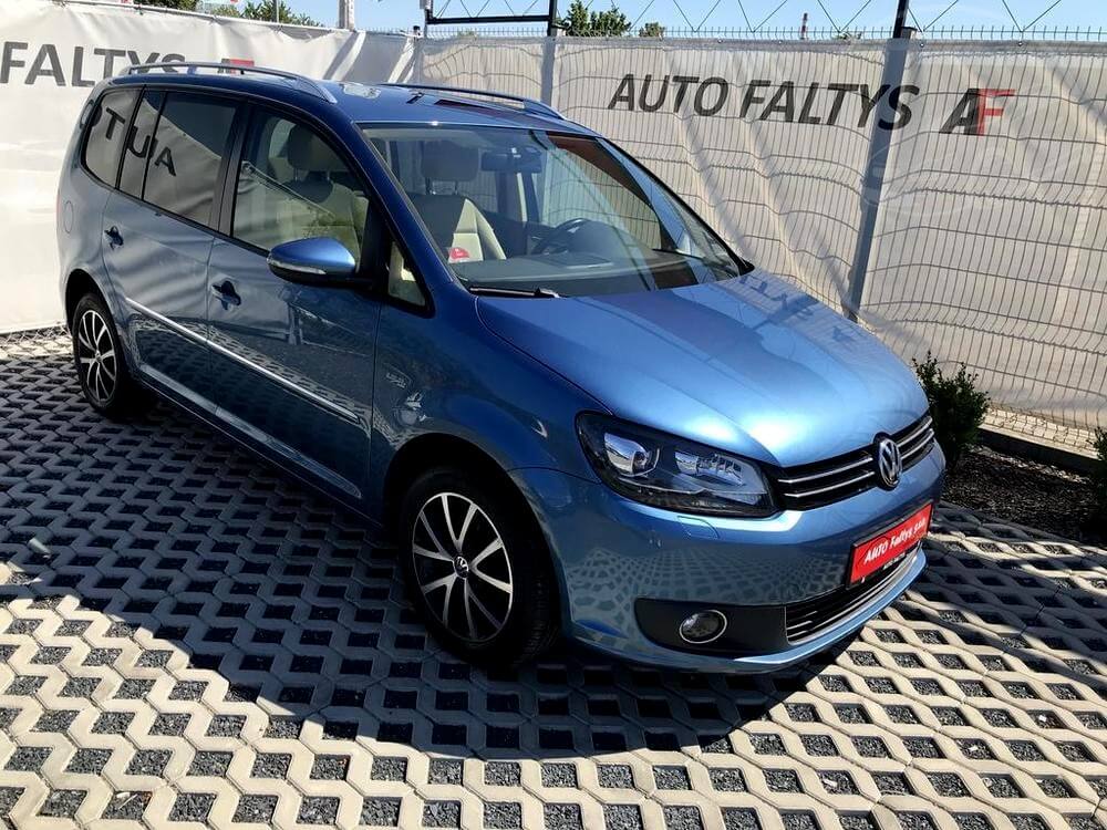 Metallic Blue Volkswagen Touran 2015, front and side view of the car body