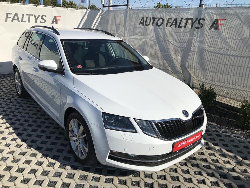 White Skoda Octavia Estate 2017 for sale at dealer Auto Faltys, front and side view of car body