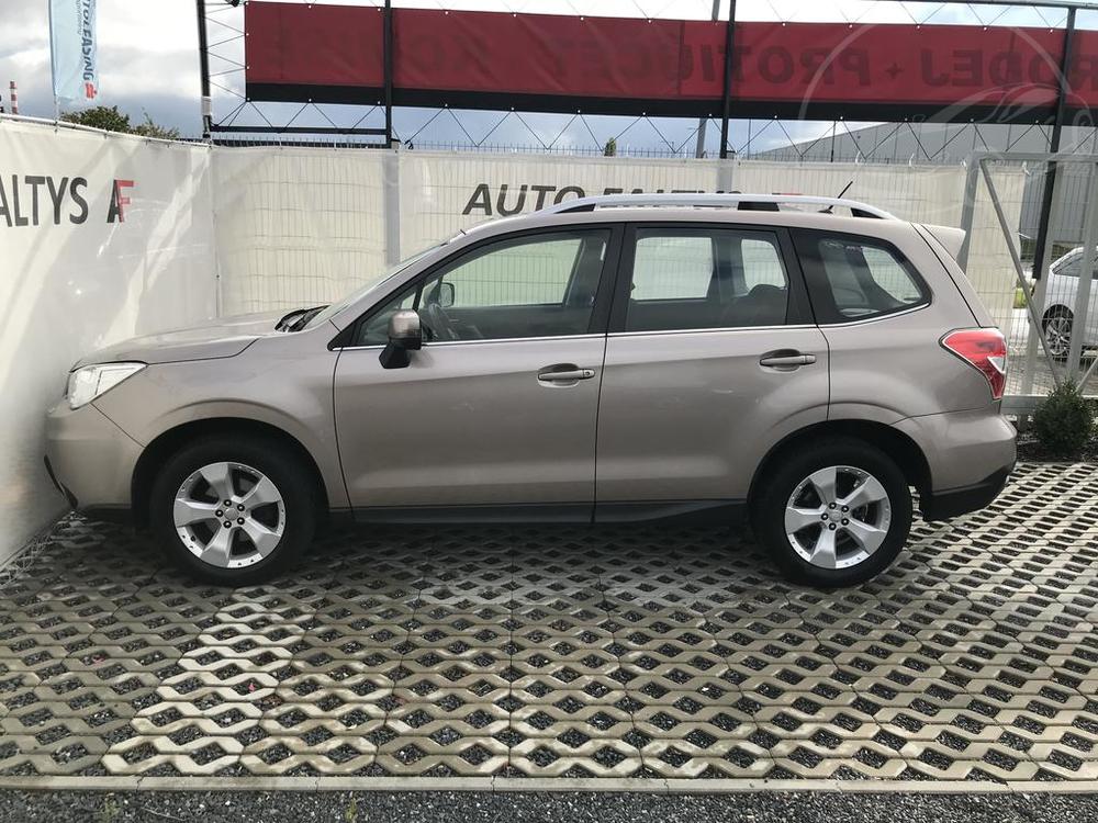 Metallic beige Subaru Forester 2013, left side view of the car body, dealer Auto Faltys