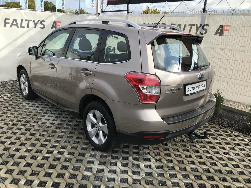 Metallic beige Subaru Forester 2013, rear and side view of the car body, dealer Auto Faltys